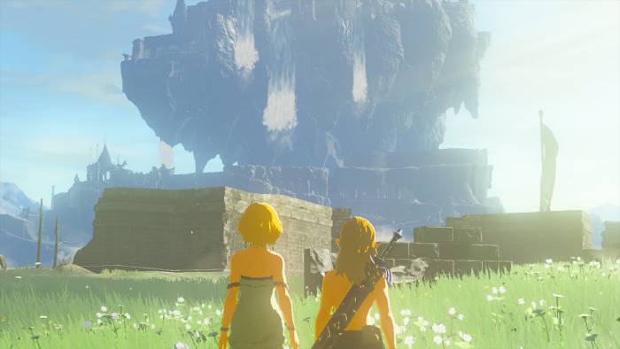 Capture écran d'une séquence du fin du jeu Zelda Tears of the Kingdom où l'on voit Zelda et Link réunis à nouveau regardant le château d'Hyrule.